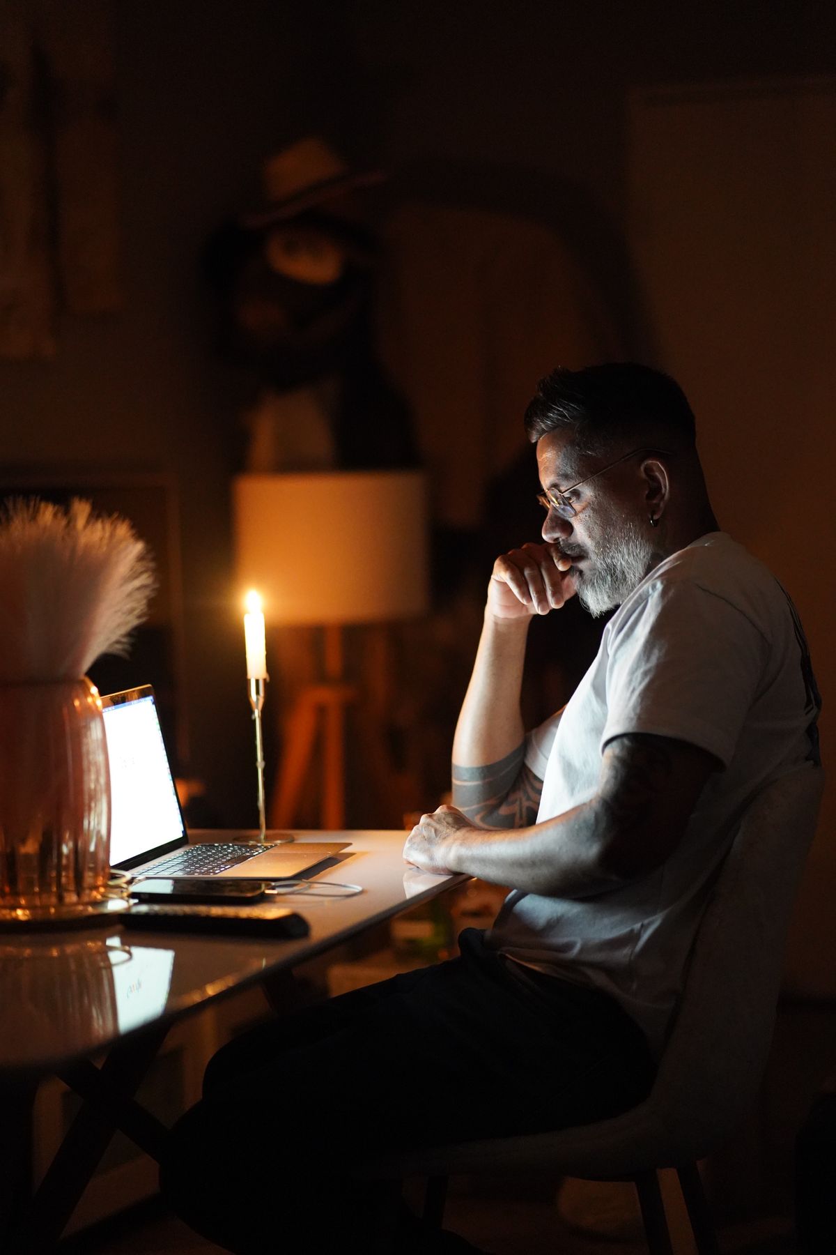 A contractor working late at a laptop