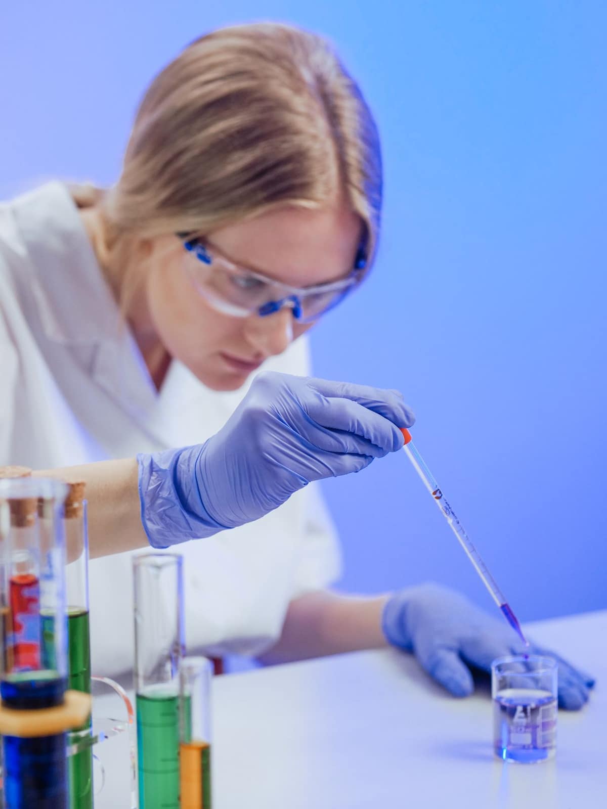 A scientist working at a bench in a research laboratory