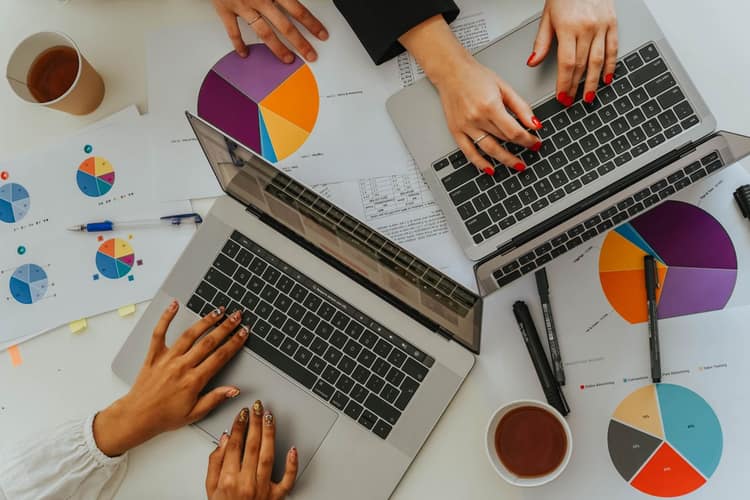 A consultant reviewing financial charts and firm performance figures