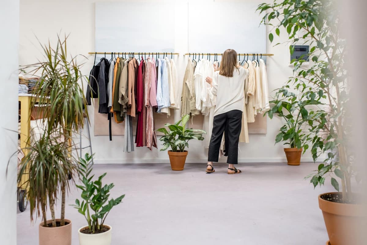 Boutique owner working behind the counter of her retail shop